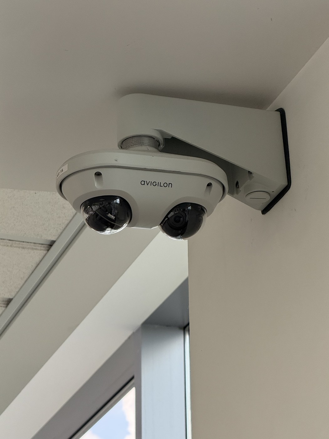Avigilon dual-sensor security camera corner-mounted at a Troy, Michigan corporate office by Michigan Security Systems