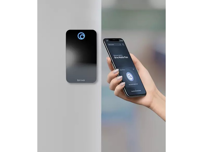 Employee using Brivo Mobile Pass smartphone credential to unlock a commercial door - Brivo access control installation by Michigan Security Systems, authorized Brivo dealer serving Michigan, Ohio and Indiana