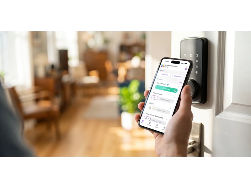 Resident using a mobile app to grant building access — Michigan Security Systems