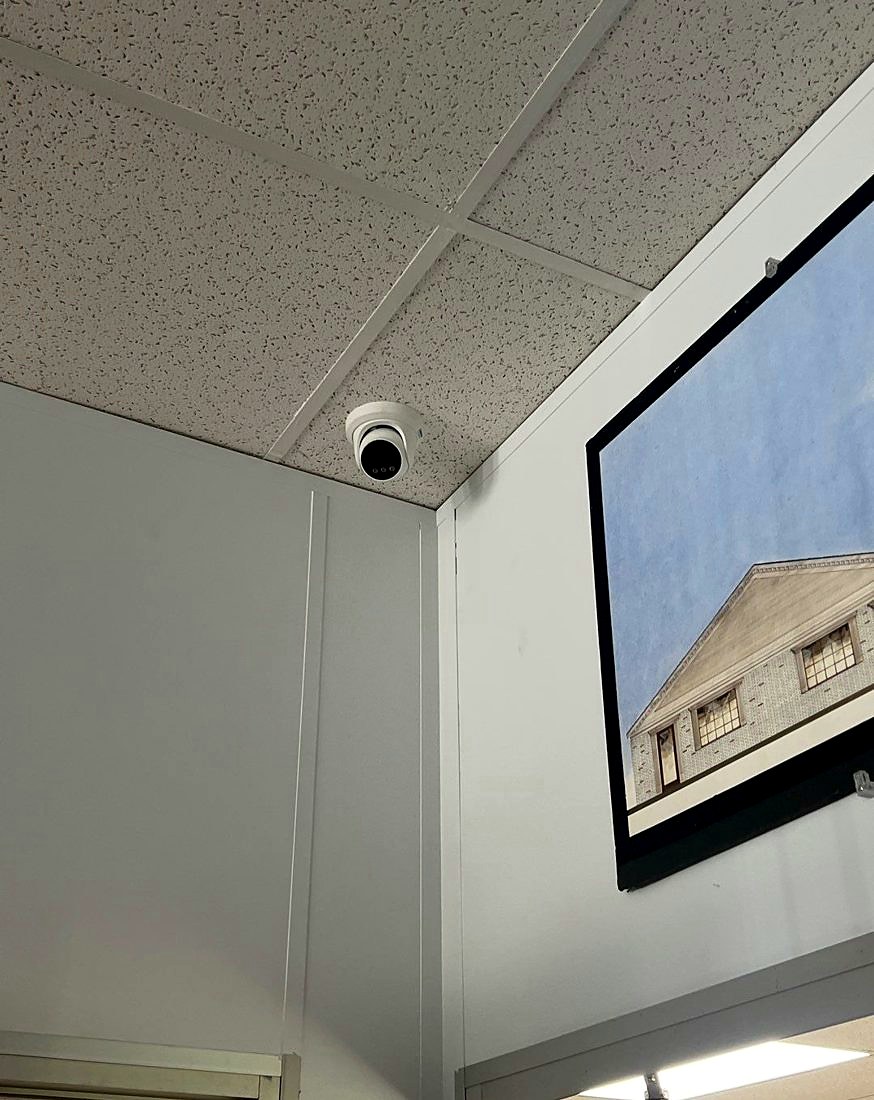 Ceiling-mounted turret dome security camera covering the lobby and entrance area at the Best Western hotel in Port Huron, Michigan, installed by Michigan Security Systems
