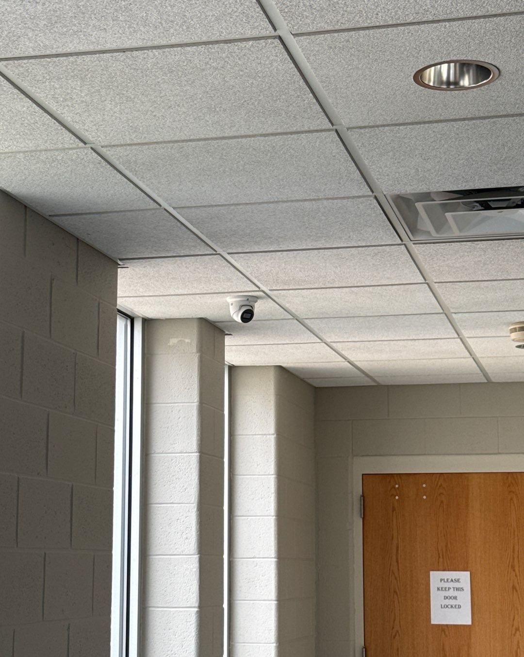 Commercial dome security camera installed in a corner office at a Royal Oak, Michigan church