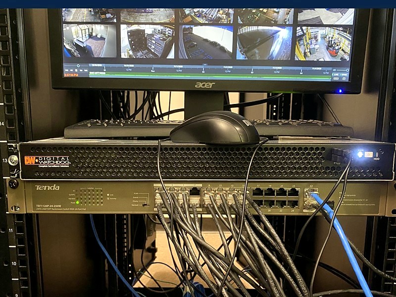 Digital Watchdog DVR and PoE network switch in a commercial security rack, installed by Michigan Security Systems