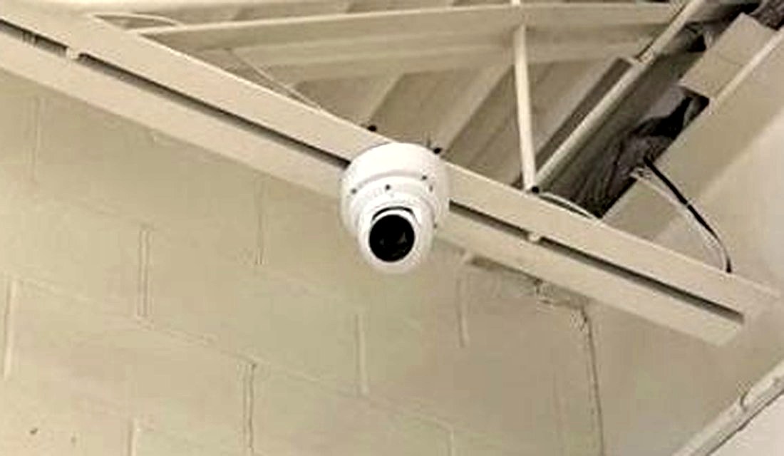 Dome security camera mounted high on the wall covering the retail floor for loss prevention at the PTO Thrift Store in Lansing, Michigan, installed by Michigan Security Systems