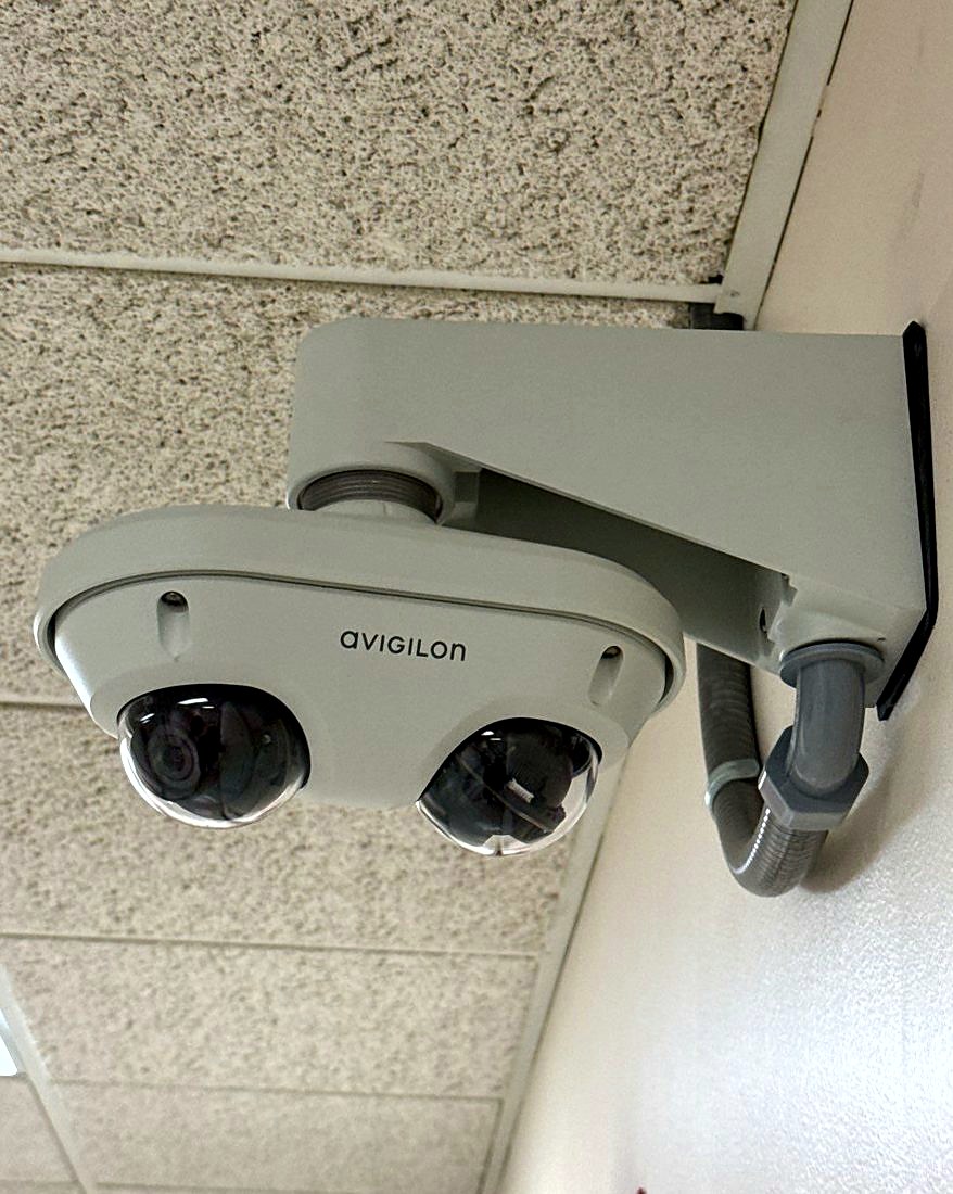 Dual-sensor Avigilon multi-head dome security camera on a wall mount at the IUOE Local 324 Howell Training Arena in Howell, Michigan, installed by Michigan Security Systems