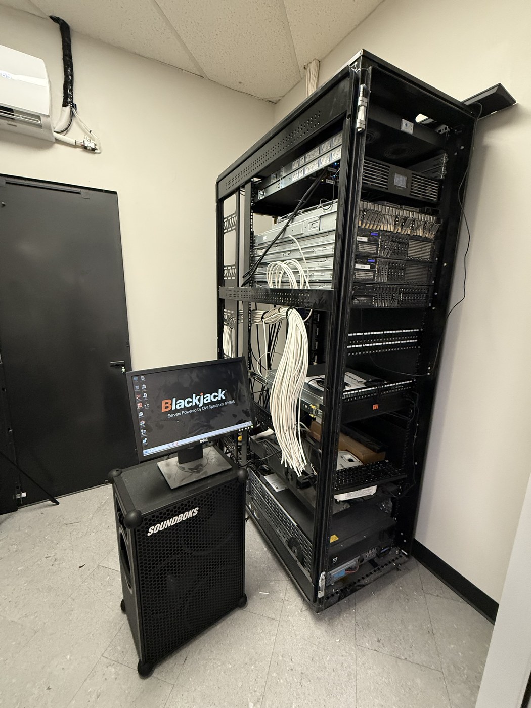 DW Spectrum NVR server rack with security camera monitoring station — Michigan Security Systems