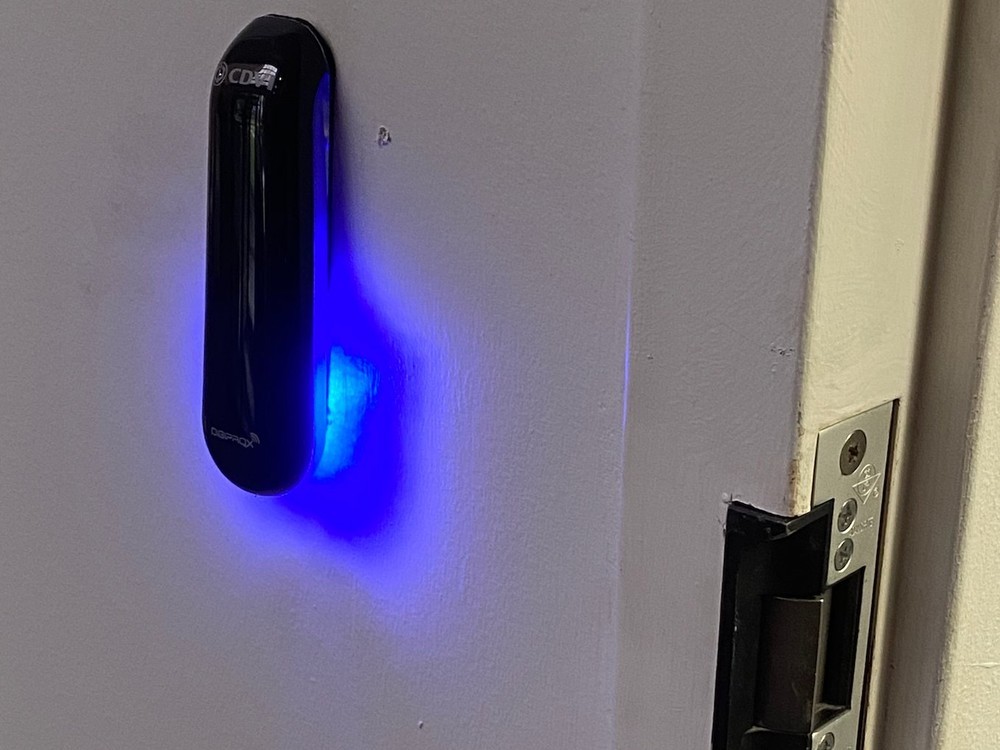 CDVI DIGIPROX proximity reader with blue indicator and electric door strike installed at a commercial door by Michigan Security Systems - CDVI access control door installation in Michigan