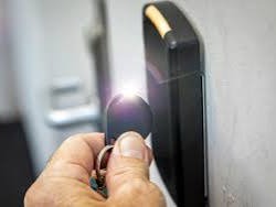 PDK access control fob reader at commercial door — installed by Michigan Security Systems, authorized PDK installer Michigan 586-466-4490