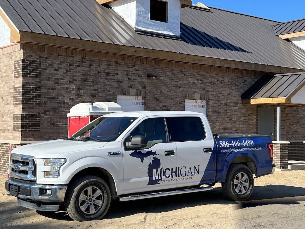 Michigan Security Systems work truck at a Michigan jobsite — authorized CDVI access control installation team serving Michigan, Ohio and Indiana