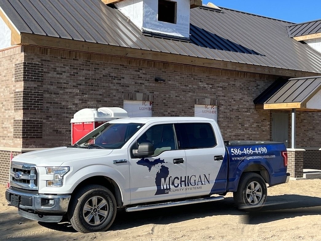 Michigan Security Systems work truck at a Michigan commercial construction site — Digital Watchdog security camera installation team serving Michigan, Ohio and Indiana