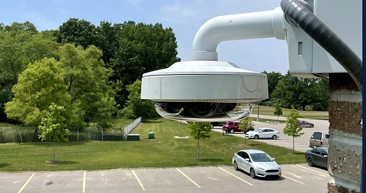 Multi-sensor PTZ dome camera covering a parking lot — Michigan Security Systems