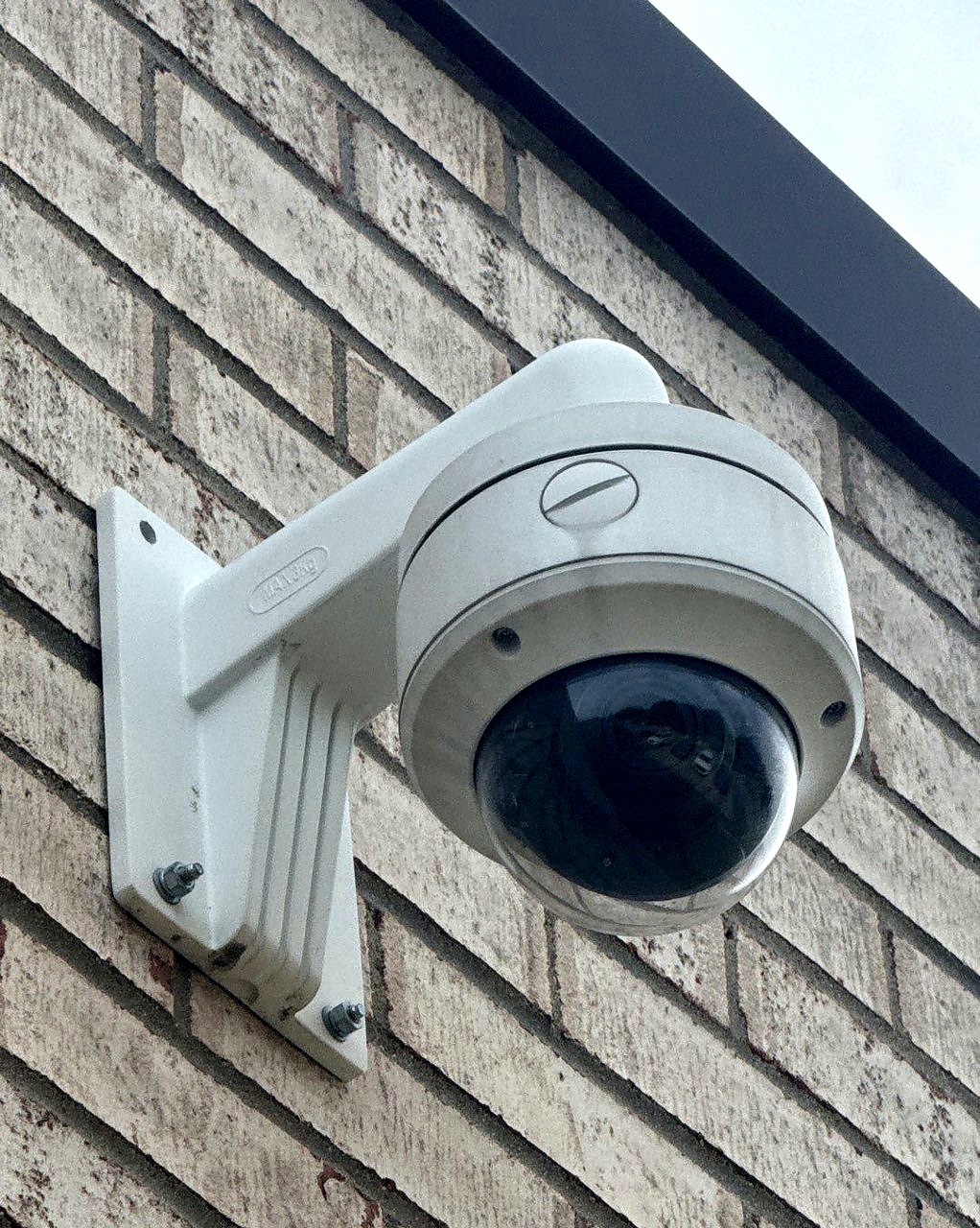 Outdoor dome security camera installed on commercial building Michigan