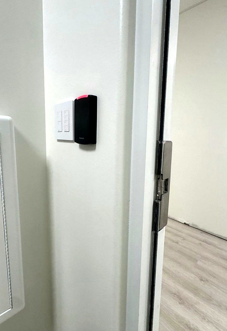 PDK access control card reader beside a door with an electric strike on the frame at The Learning Experience childcare center in Michigan, installed by Michigan Security Systems