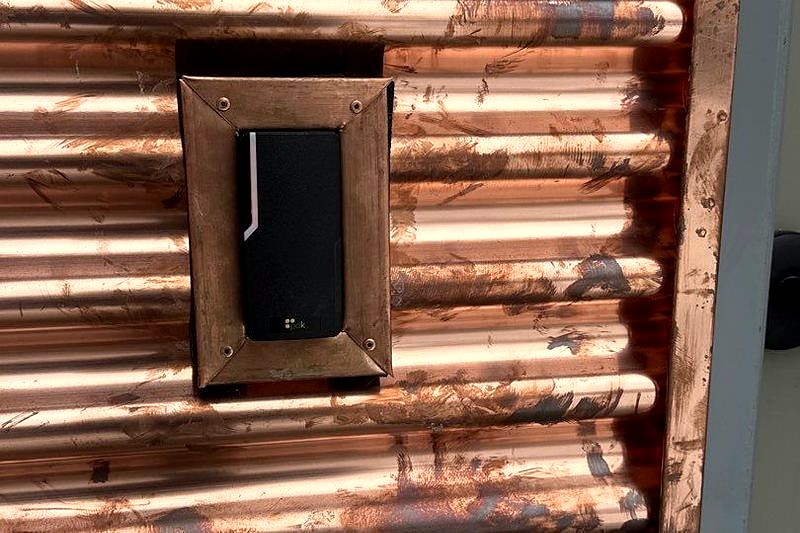 PDK Card Reader Outdoor Wall Mount Installation Michigan | Commercial Access Control | Michigan Security Systems 586-466-4490 PDK Access Control Card Reader Installed on Corrugated Metal Wall — Outdoor Commercial Access Control Michigan Security Systems