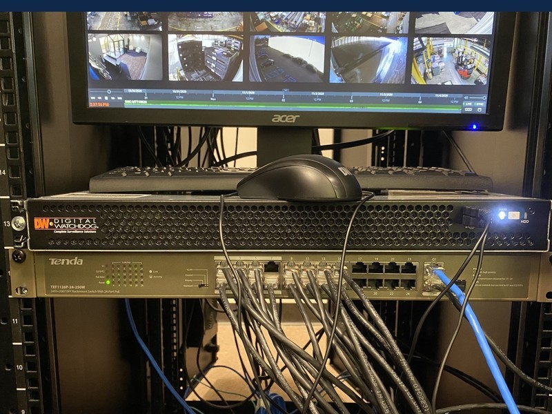 Digital Watchdog DVR and PoE network switch in a commercial security rack, installed by Michigan Security Systems