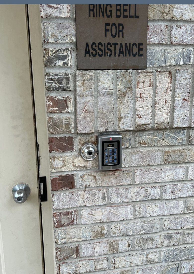 PDK cloud-based access control keypad reader mounted by the entry door at Bruce Township City Hall in Romeo, Michigan, installed by Michigan Security Systems