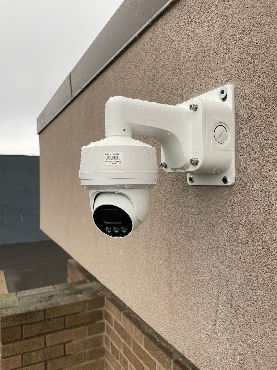 Close-up of a dome security camera on a weatherproof mount installed by Michigan Security Systems in New Baltimore