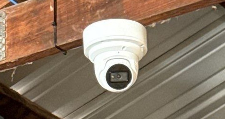 4K IP turret dome camera mounted under metal roofing — Michigan Security Systems