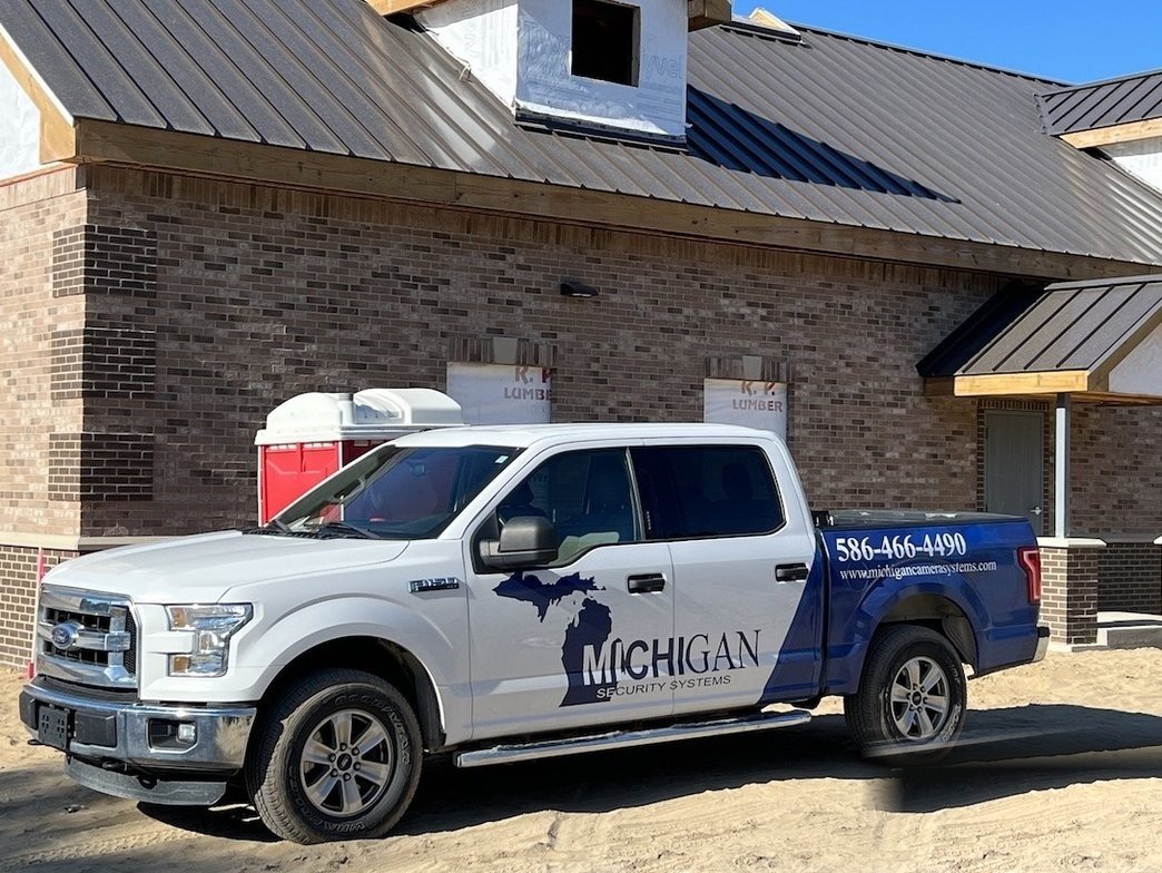 Michigan Security Systems work truck at a Michigan jobsite — authorized Hikvision camera installation team serving Michigan, Ohio and Indiana