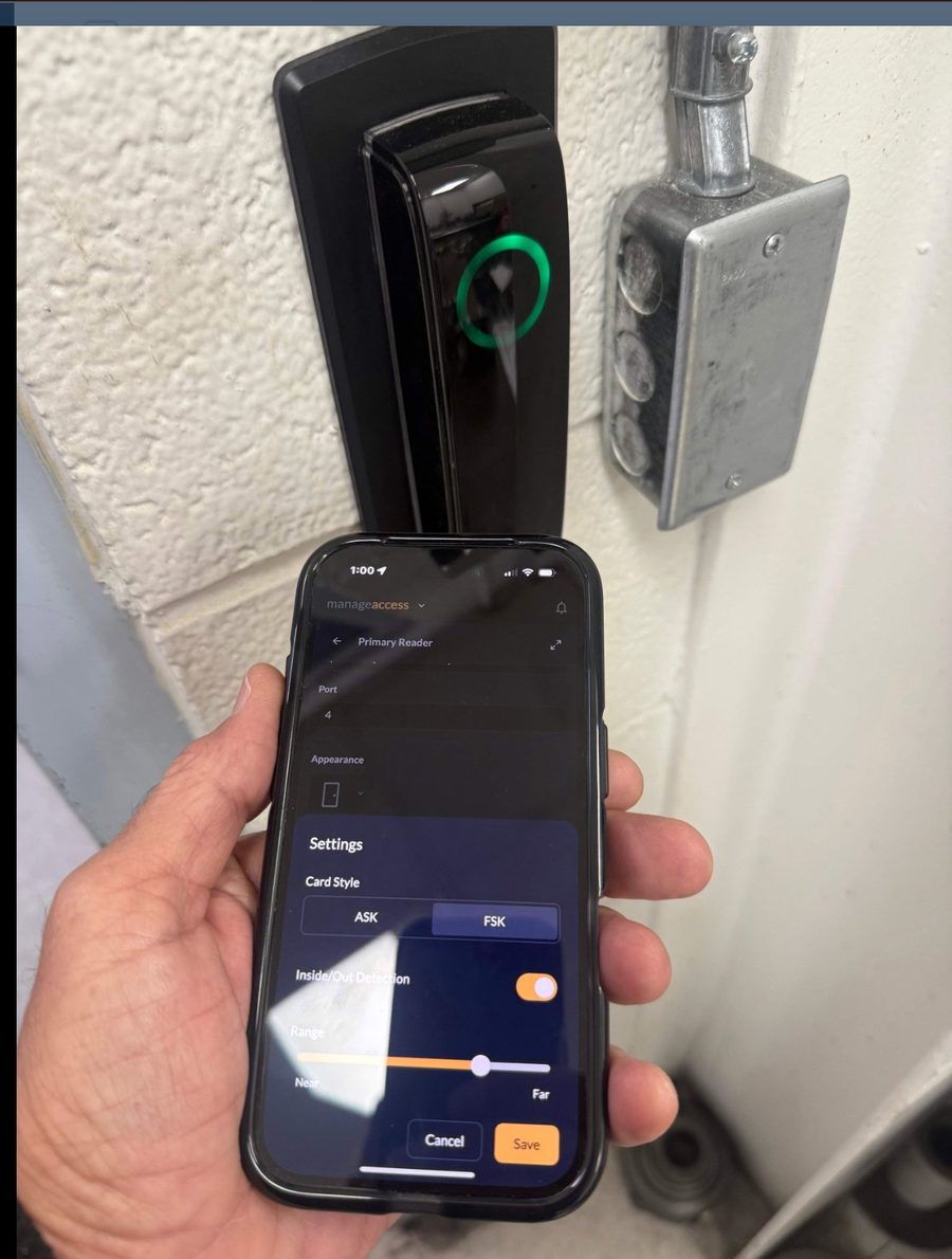 PDK access control reader with green ready ring and the PDK manageaccess app configuring the Primary Reader at the J.G. Kern Enterprises automotive plant in Sterling Heights, Michigan