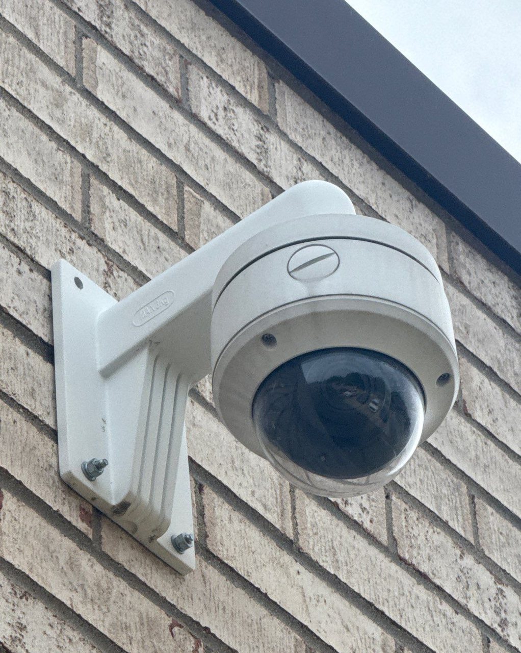 Outdoor dome security camera installed on commercial building Michigan