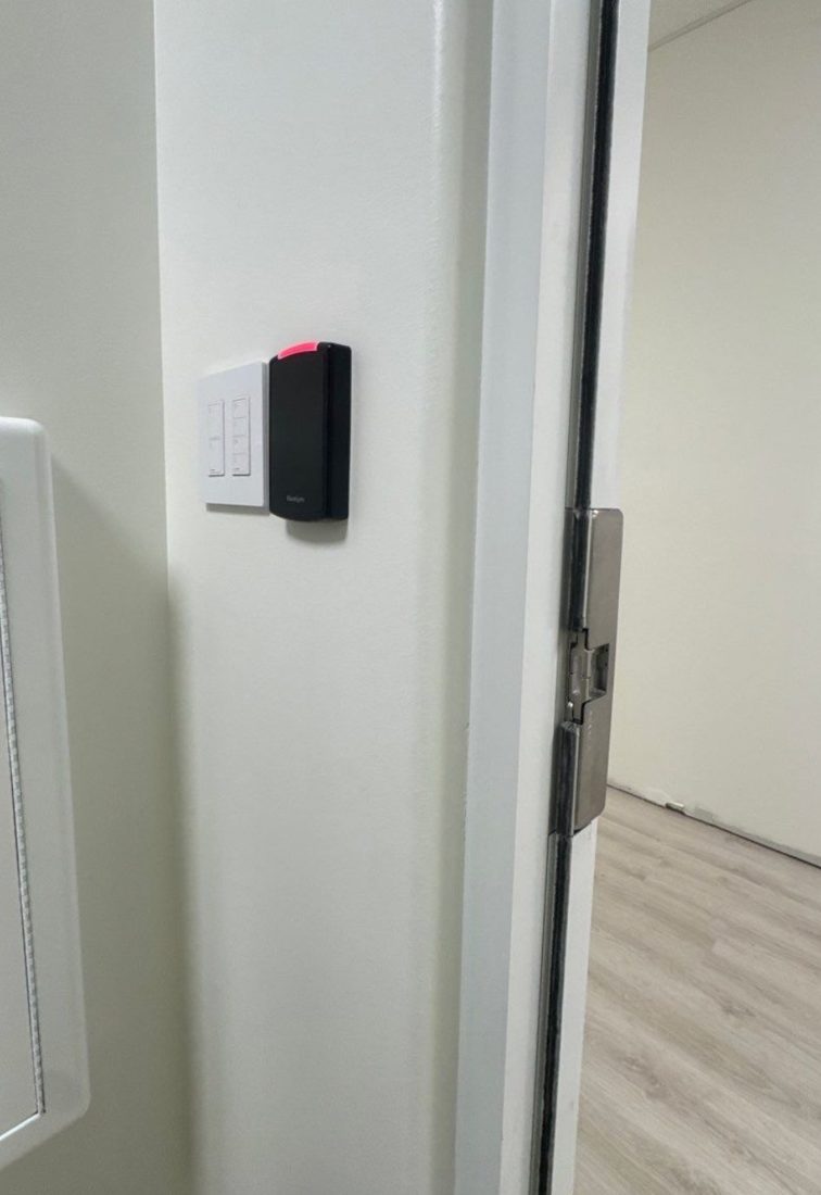 PDK access control card reader beside a door with an electric strike on the frame at The Learning Experience childcare center in Michigan, installed by Michigan Security Systems