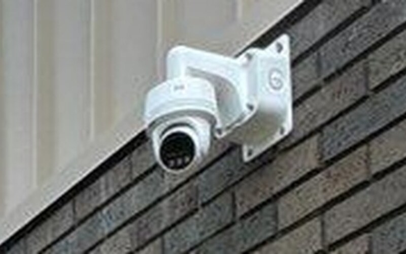 Commercial security camera on a brick building installed by Michigan Security Systems