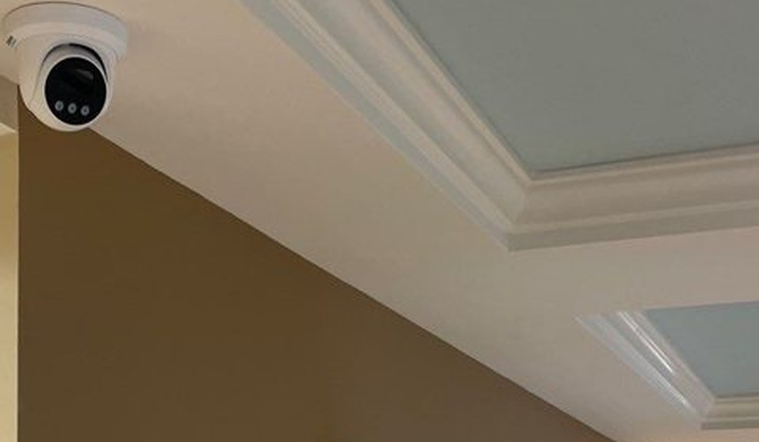 Turret security camera covering a guest corridor at the Best Western hotel in Port Huron, Michigan, part of full-property camera coverage installed by Michigan Security Systems