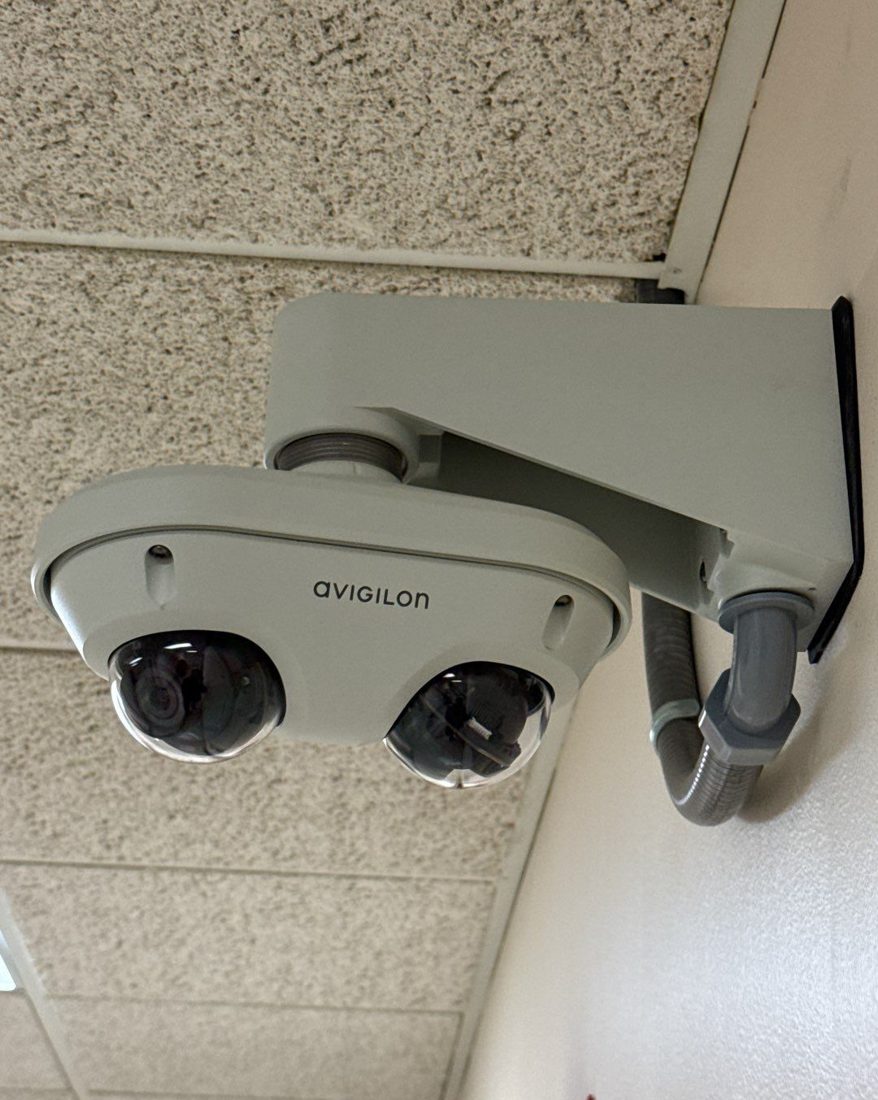 Dual-sensor Avigilon multi-head dome security camera on a wall mount at the IUOE Local 324 Howell Training Arena in Howell, Michigan, installed by Michigan Security Systems
