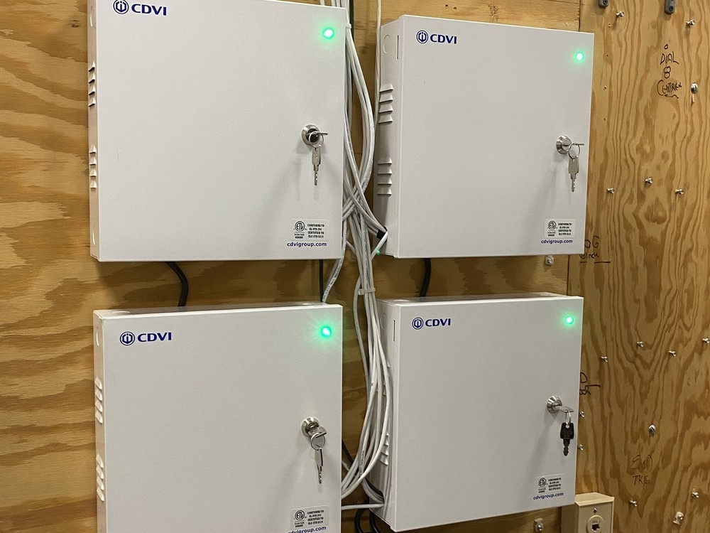Four CDVI ATRIUM access control controller enclosures professionally installed and wired by Michigan Security Systems on a commercial backboard - CDVI ATRIUM A22 access control installation in Michigan