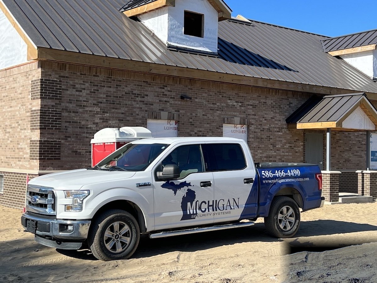 Michigan Security Systems service truck at new commercial construction site in Michigan — commercial security integrator