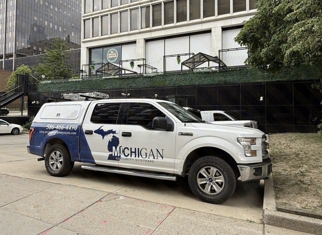 Michigan Security Systems branded service truck at a commercial job site — Michigan Security Systems