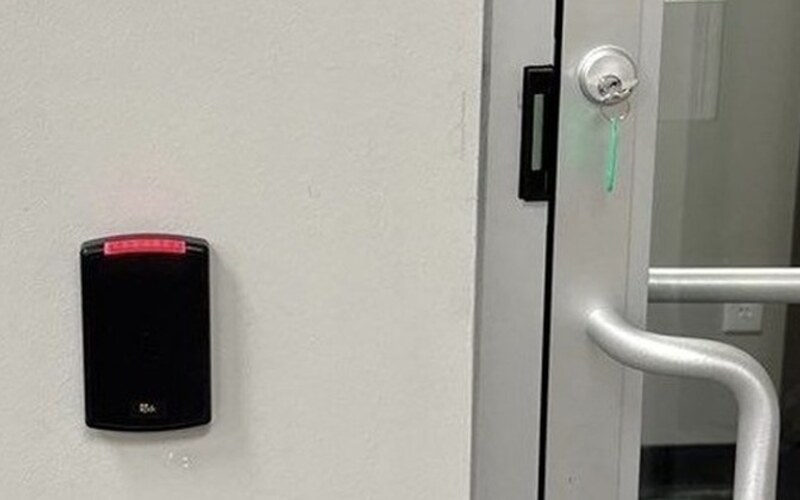 PDK proximity card reader at a commercial entry door installed by Michigan Security Systems