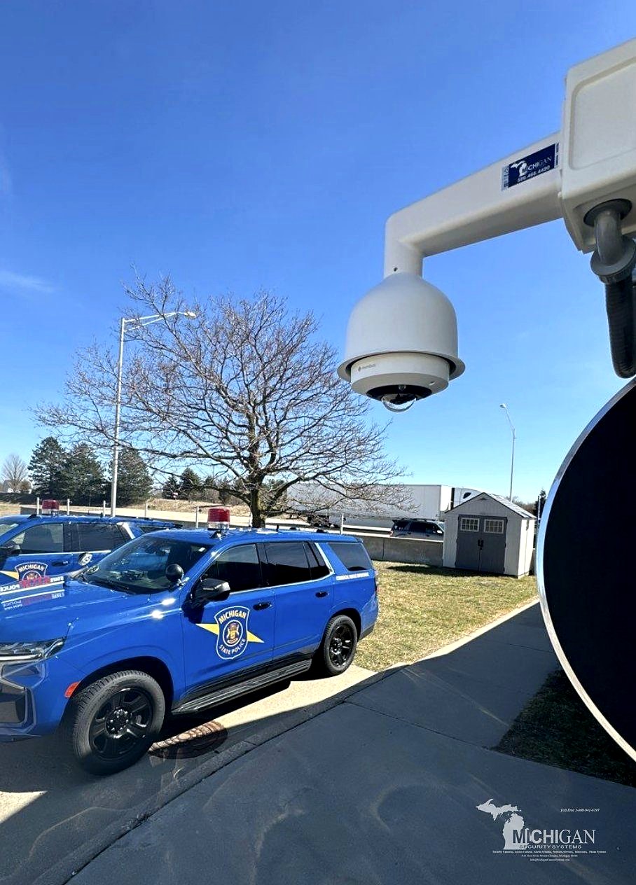 PTZ dome security camera at a Michigan State Police post with state police vehicles — Michigan Security Systems