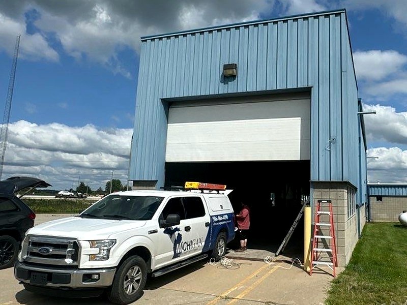 Michigan Security Systems service truck on site at a commercial building during a security camera and access control installation in Michigan