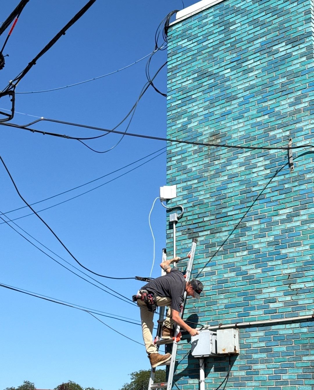 Michigan Security Systems technician installing a Digital Watchdog security camera at River Rouge Police Department